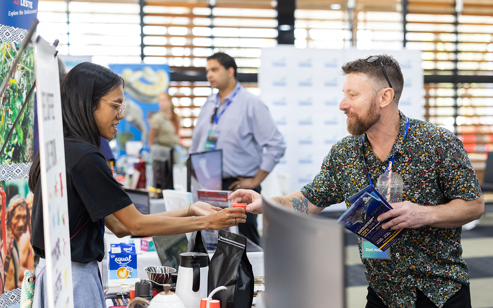Trade show vendor shaking hands