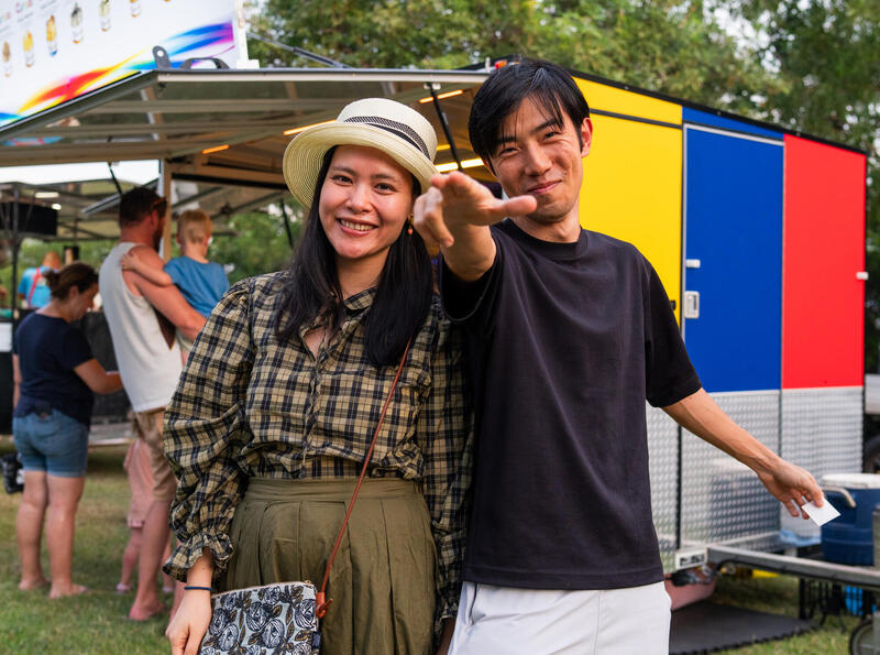 Couple enjoying food truck at event