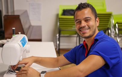 Man using sewing machine