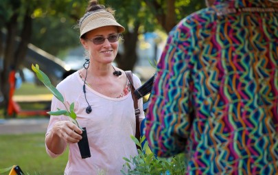 Lady holding native plant.