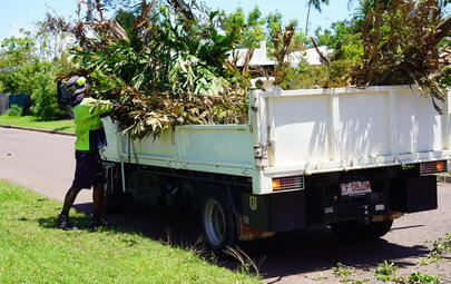 Cyclone cleanup crew filling truck