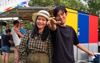 Couple enjoying food truck at event