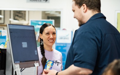 image of lady at the customer service desk