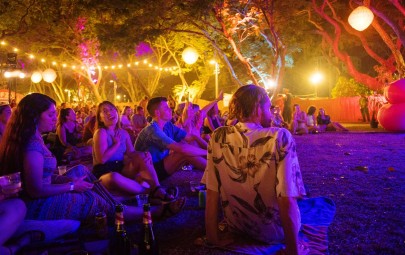 Crowd sitting under lights at event