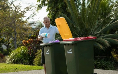 Man putting recycling in bin