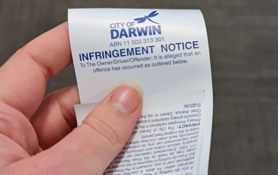 handing over an infringement notice