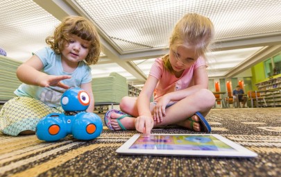 Kid playing with toy at the library