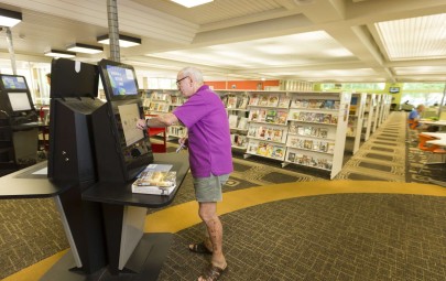 man using computer at library