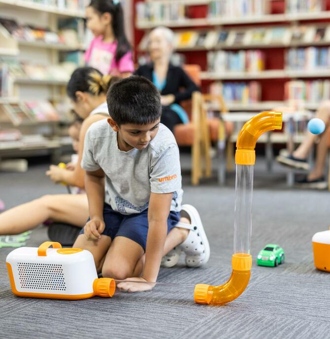 image of young person interacting with osmo toy