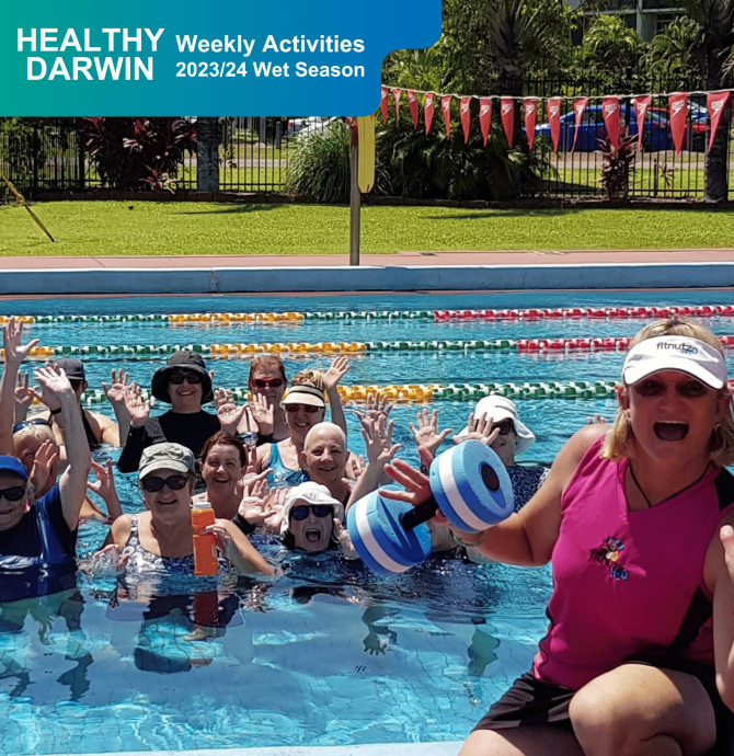 Group of people smiling at camera and waving in the pool after Aqua HIIT
