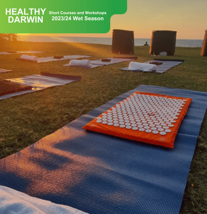 Acupressure mats lined up on the foreshore next to ice baths.
