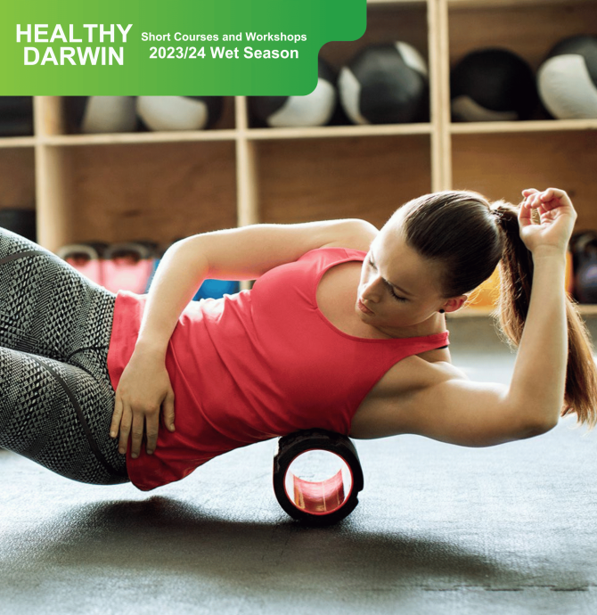 Lady laying on a foam roller on her side stretching out.
