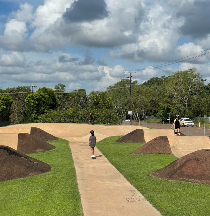 skate boarder and roller skater using track at Howards Springs skate park