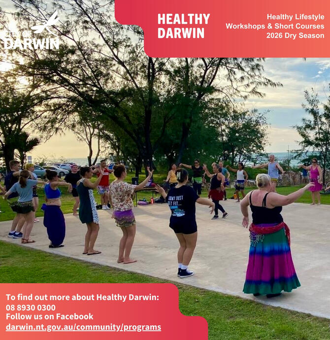 social media tile - a group of people dancing on the outdoor concrete area overlooking the sea