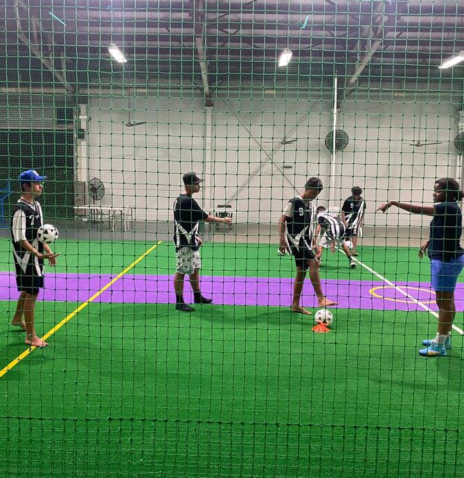 Young people in team jerseys playing ball sports