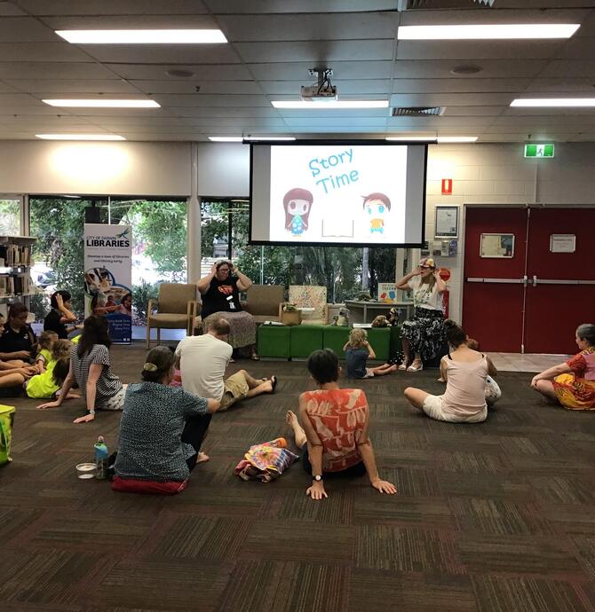 families enjoying story time