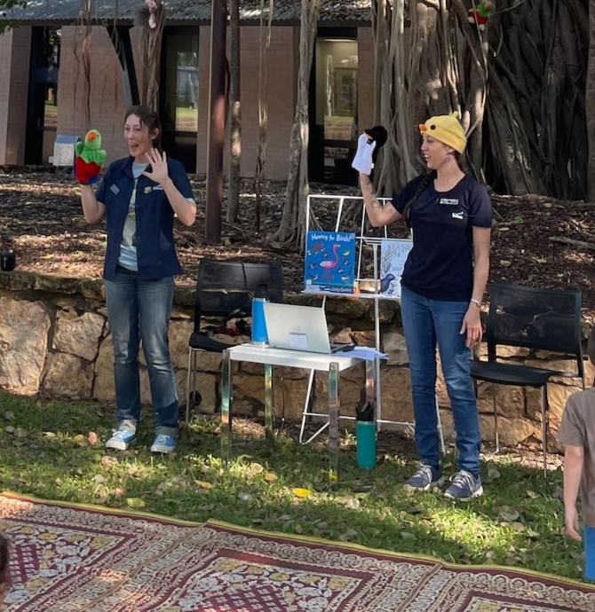 image of staff members doing story time