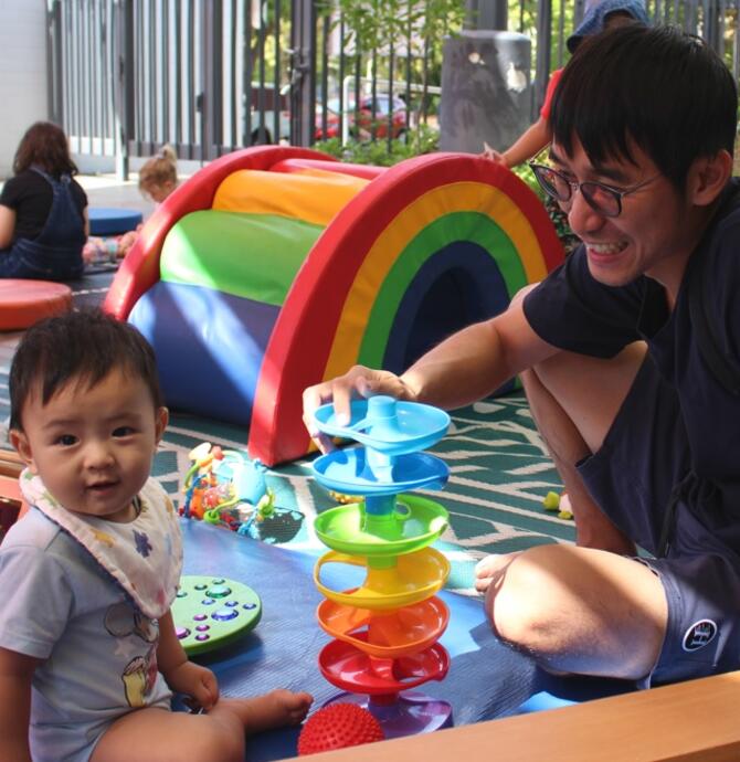 baby and father playing together