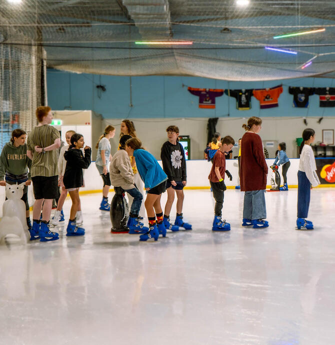 ice skaters standing in a line