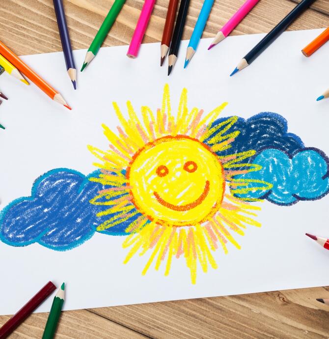 drawing of sunny face with clouds around