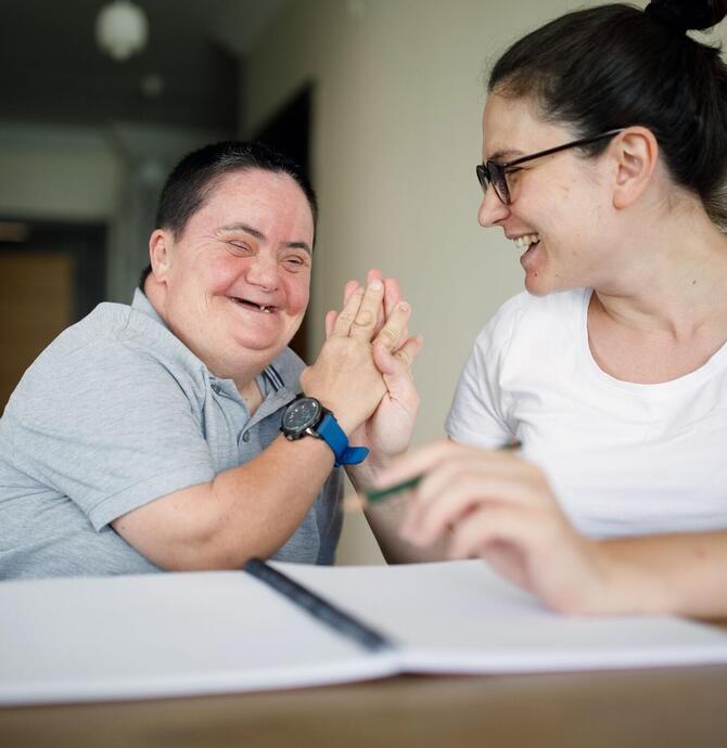 image of two people holding hands