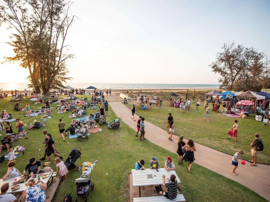 Food stall and people having picnic at beach
