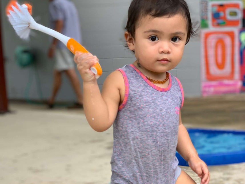 Child playing in the tough tray