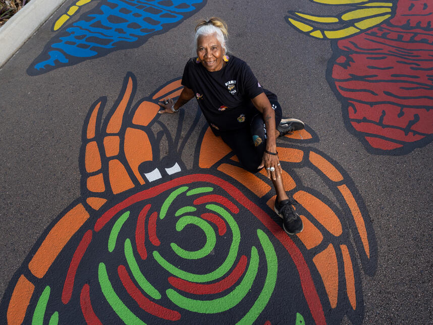 Hermit Hustle. Hand painted mural on road surface. Cnrs Smith and Searcy streets.