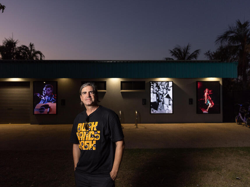 Curator Jeremy Taylor from MusicNT with lightboxes at Nightcliff Pool location.