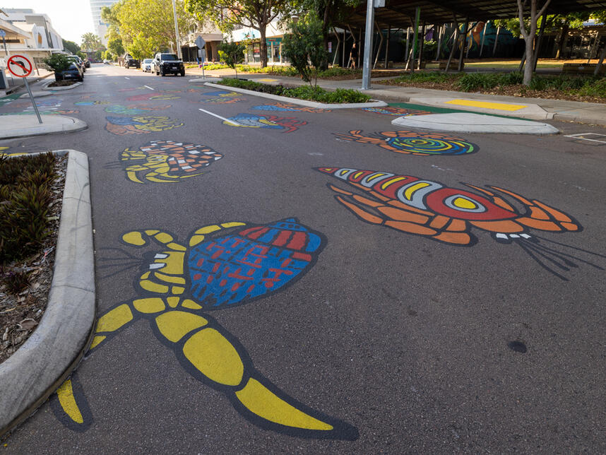 Hermit Hustle. Hand painted mural on road surface. Cnrs Smith and Searcy streets.