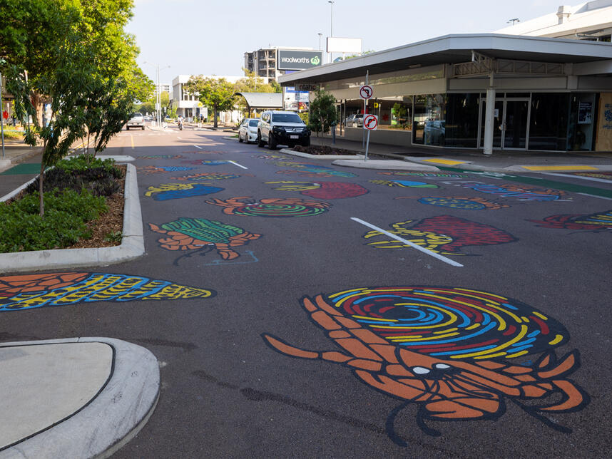 Hermit Hustle. Hand painted mural on road surface. Cnrs Smith and Searcy streets.