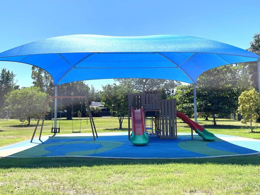 Shaded playground - swings and slides (front view)