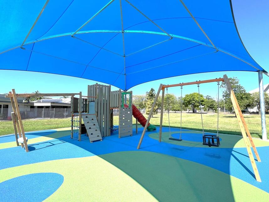 Shaded playground - climbing frame and swings view
