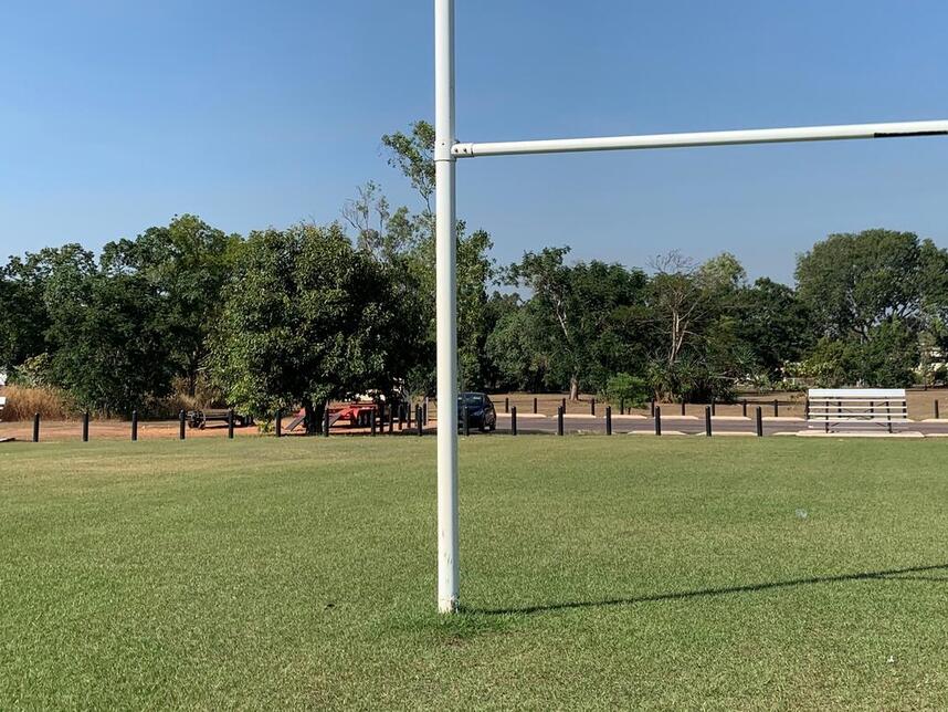 looking past the rugby goal post to both mini grandstands for teams to use during training and competition