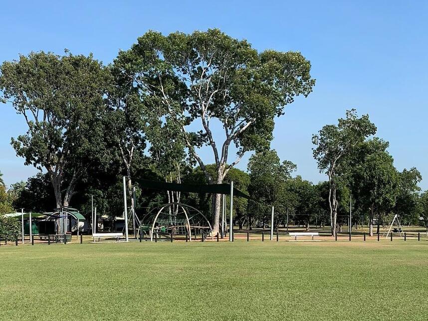 pano showing amenities block, playground and some oval spectator seating along the boundary fenceline