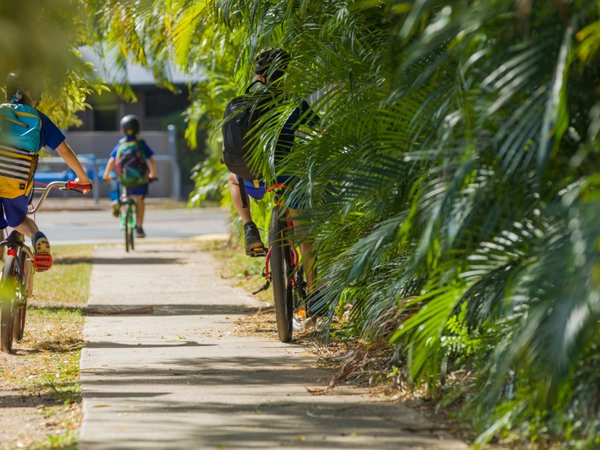 Child ride bike along the footpath