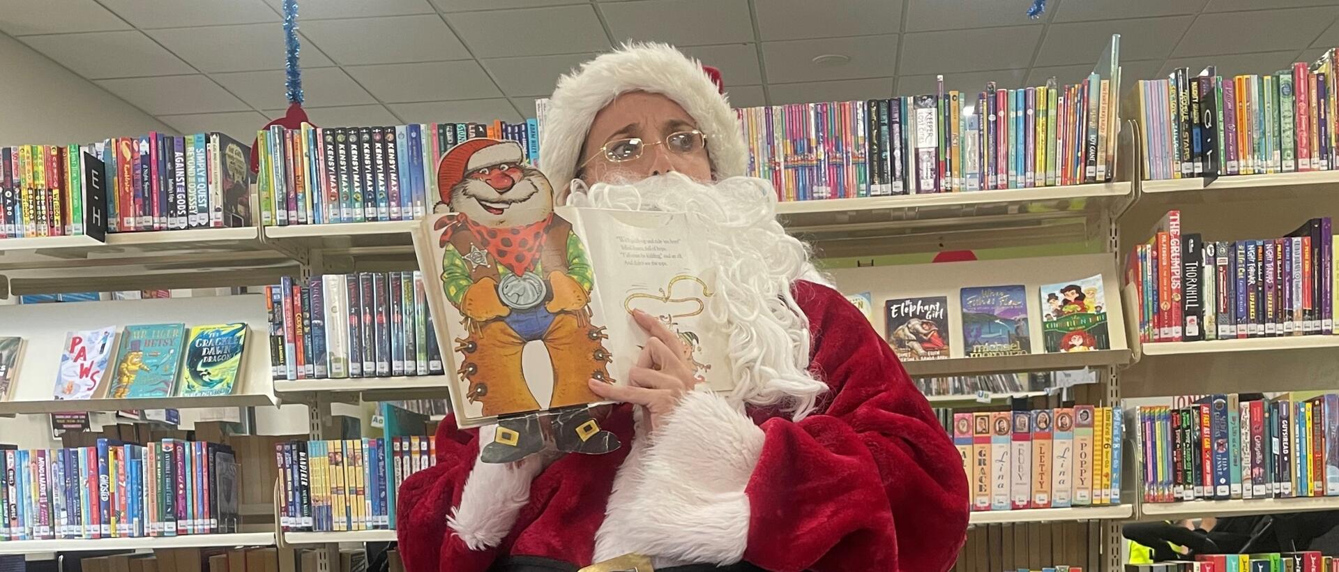 Santa reading at book at story time