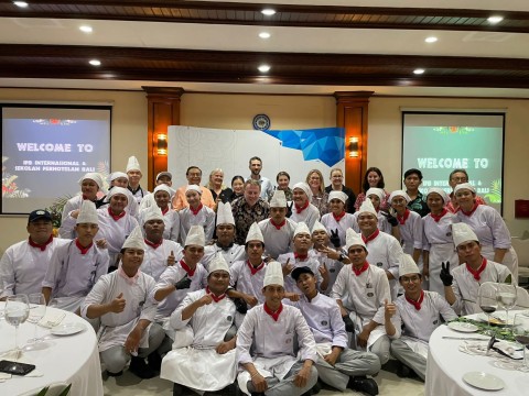 Large group of Indonesian students dressed in chef uniforms