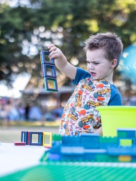 Young boy playing with magnets