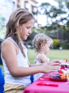 Two young children doing crafts