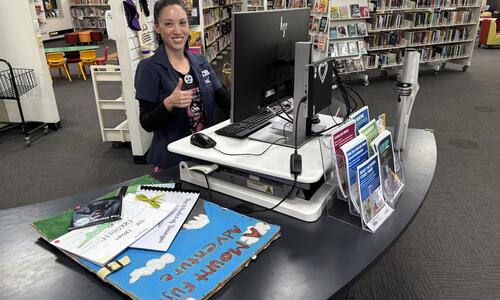 Libraries team adds Young Authors books in system