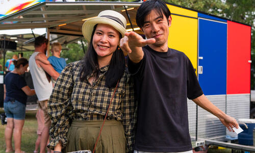 Couple enjoying food truck at event